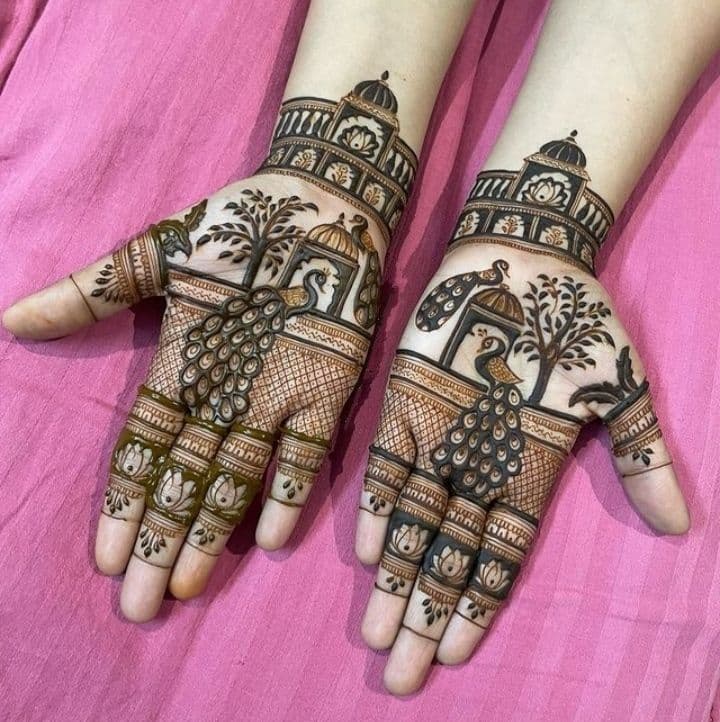 Intricate bridal mehandi with peacocks and palace motifs on both palms
