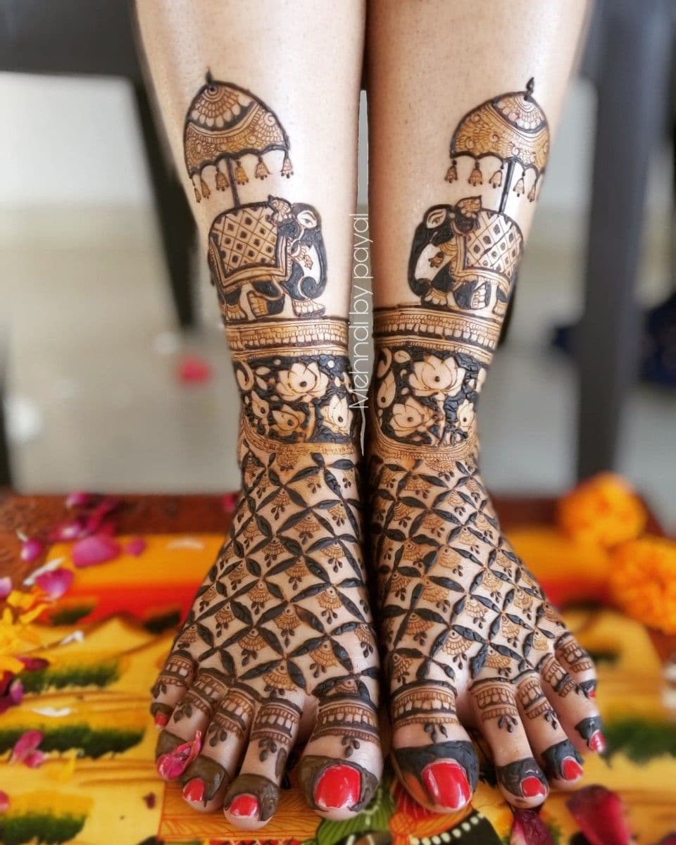 Bridal feet mehandi with elephant and umbrella motifs